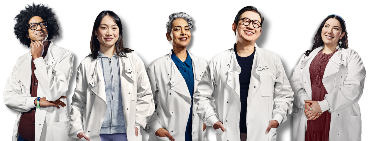 Image of several scientists in lab coats standing side by side
